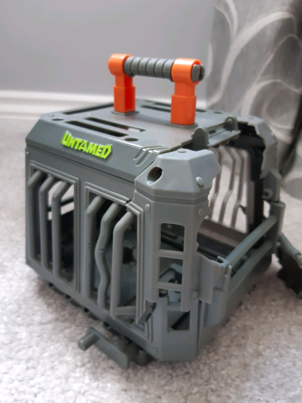 untamed raptor with cage